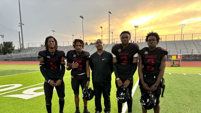 Dymally football's (L-R) Milton Catching, Tramonte Lowe, coach David Wiltz, Bryant Collins, Jermaine Whiten.